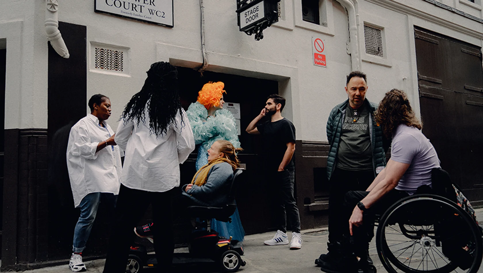 Group of Equity members outside a stage door