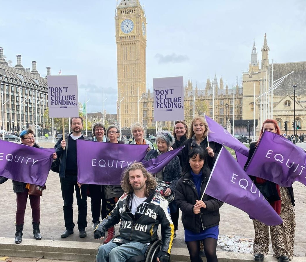 Photo shows equity members outside of parliament