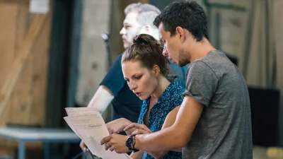 Man and woman reading script together