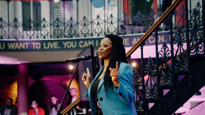 Woman Talking On Stage At A Rally At Annual Representative Conference