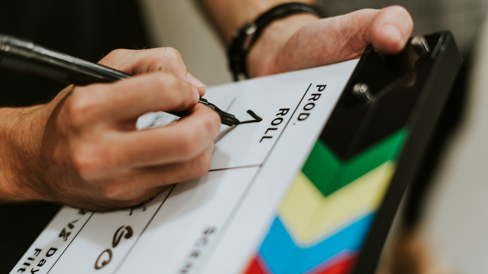 Hand Filling Details On Film Clapperboard