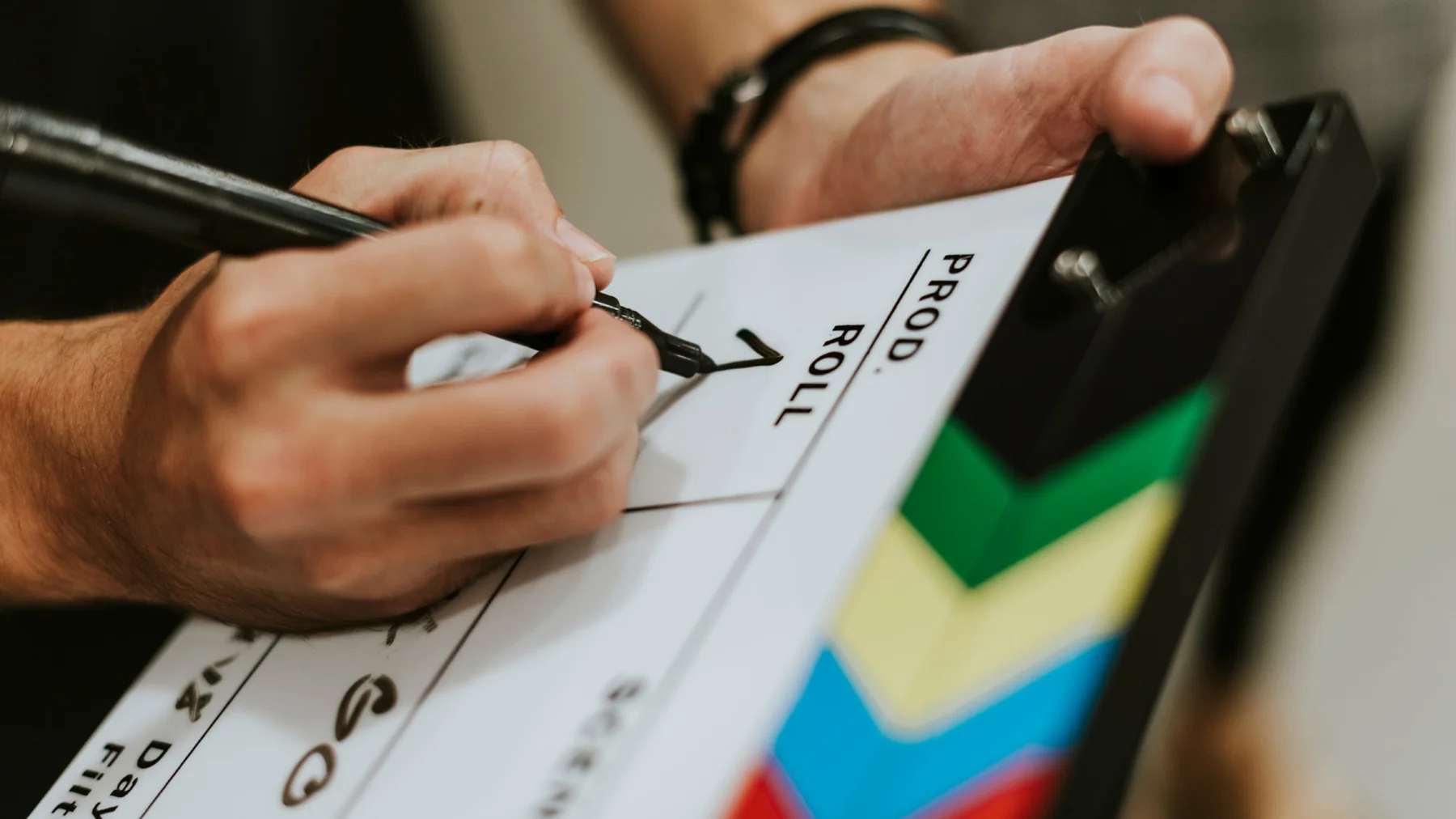 Hand Filling Details On Film Clapperboard